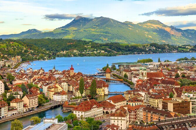 Exclusive Panoramic Train Journey though the Heart of Swiss - Lucerne in about an hour: Lion Monument, Chapel Bridge, and the Jesuit Church