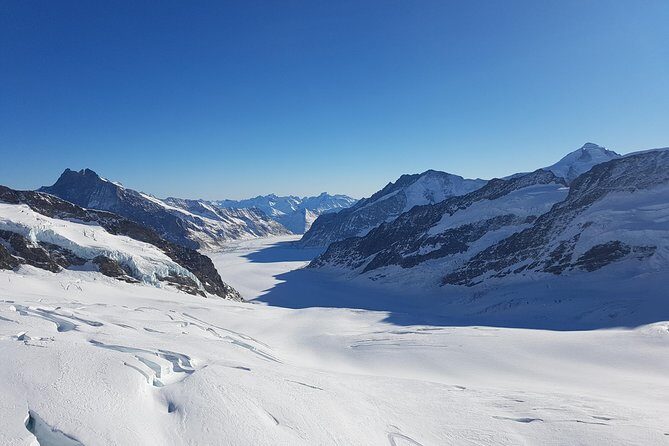 Jungfraujoch Top of Europe Private Day Trip from Basel - Grindelwald to Jungfraujoch: cableway, cogwheel, and those photo stops
