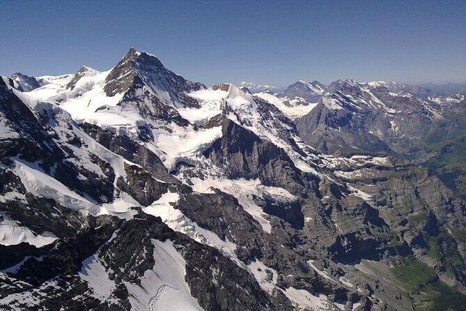 Matterhorn helicopter tour - longest scenic flight from Bern over the Swiss Alps - Oeschinensee and turquoise-blue lake views from above