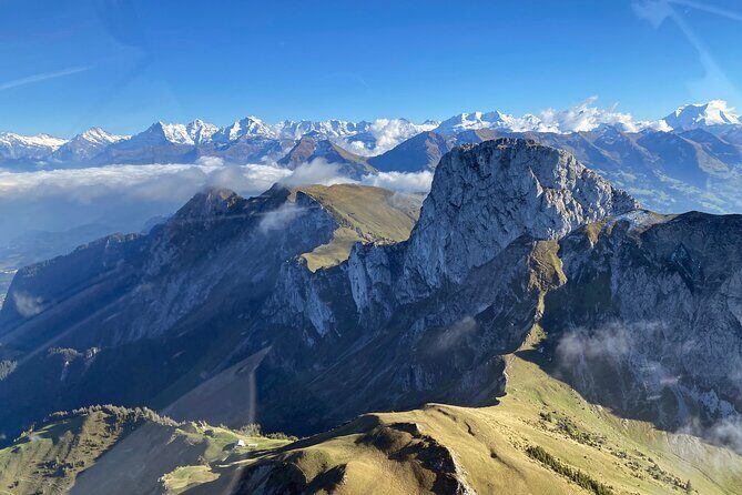 Private helicopter flight to Stockhorn mountain, with view to the Swiss Alps - Belp Berg and Bern: farmland on top, capital in one glance