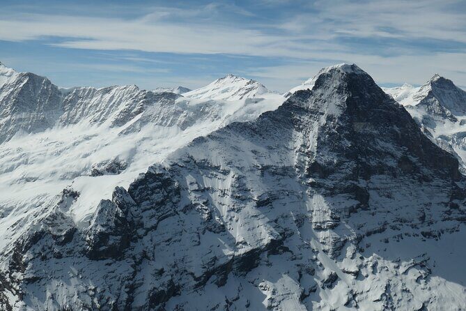 Private helicopter tour to the Swiss Alps - see the Eiger, Monch and Jungfrau - Bernese Oberland villages and mountain huts: seeing the no-road puzzle