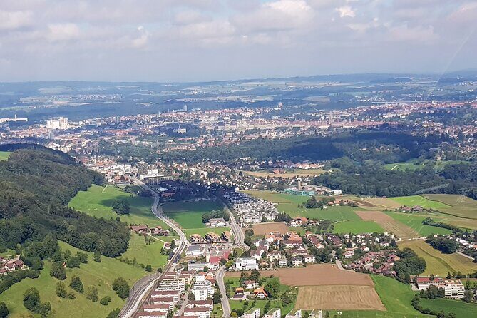 Swiss Capital city helicopter sightseeing tour - the ideal flight to see Berne - Bundeshaus dome and the cathedral steeple from the air
