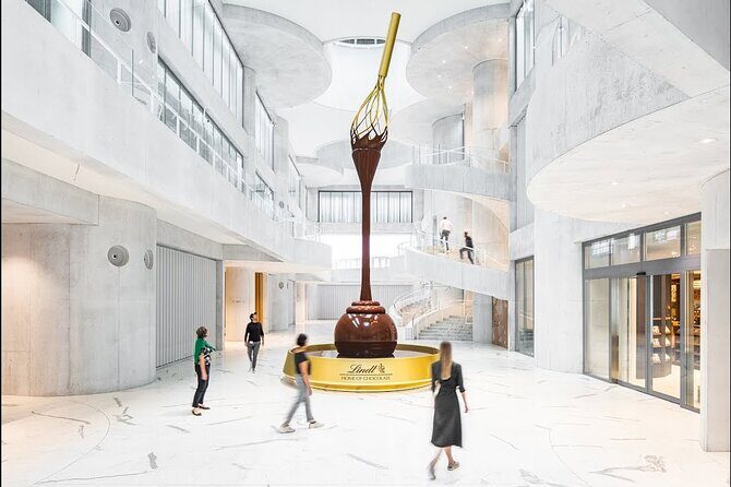 Tour in Lindt Home of Chocolate Museum From Zurich With pickup - Walking in: the 9-meter chocolate fountain and an audio-guided story